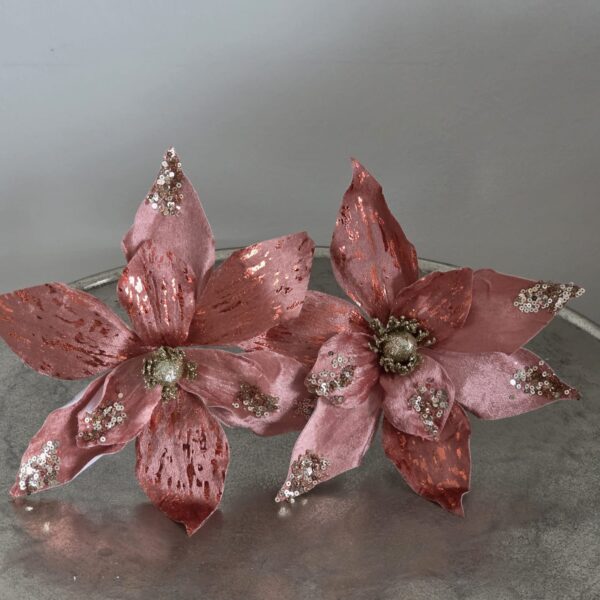 Sprankelende oud roze poinsettia met glitters.
